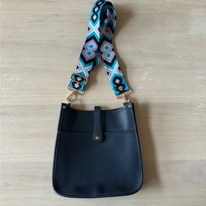 Navy leather saddle bag with embroidered strap